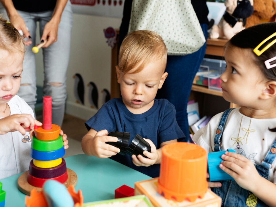 Small Children Playing With Toys